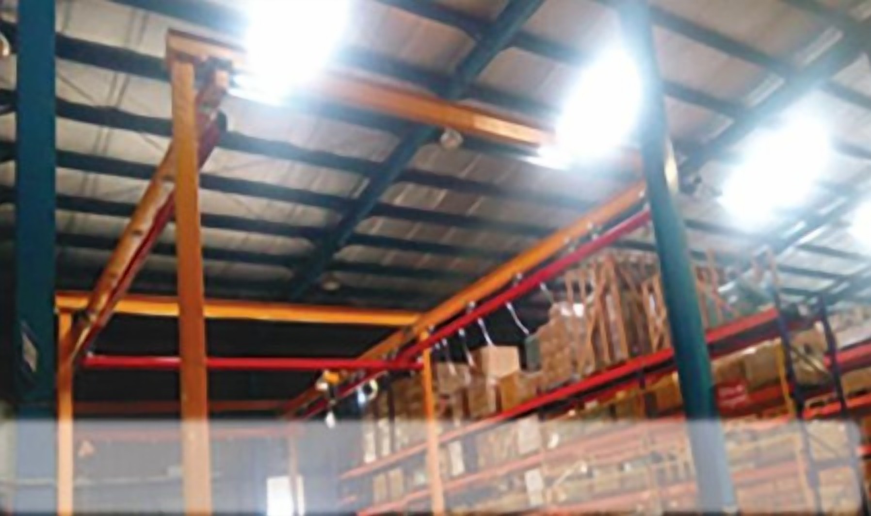 X-Y rail system on a pillar-mounted structure